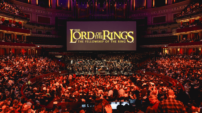 Royal Albert Hall illuminated for Films in Concert series, showcasing iconic movie scenes and live orchestral performances