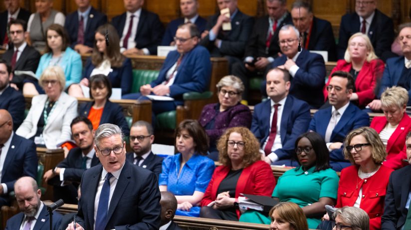 Keir Starmer addressing backbench MPs in a parliamentary setting, highlighting political strategy and leadership discussions.