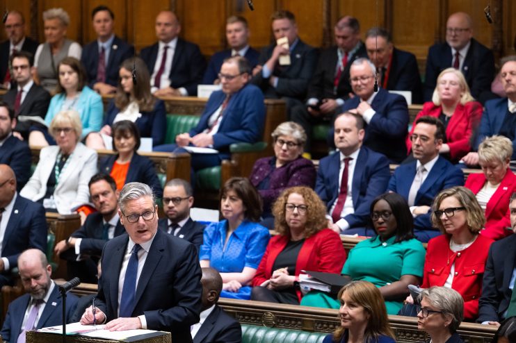 Keir Starmer addressing backbench MPs in a parliamentary setting, highlighting political strategy and leadership discussions.