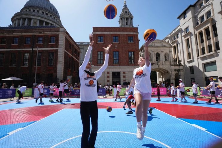 Team England athletes participating in the Kings Baton Relay at the London Sports Festival during their relay leg