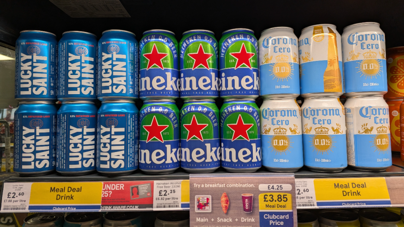 Tesco meal deal featuring Heineken and Corona beer bottles displayed on a store shelf