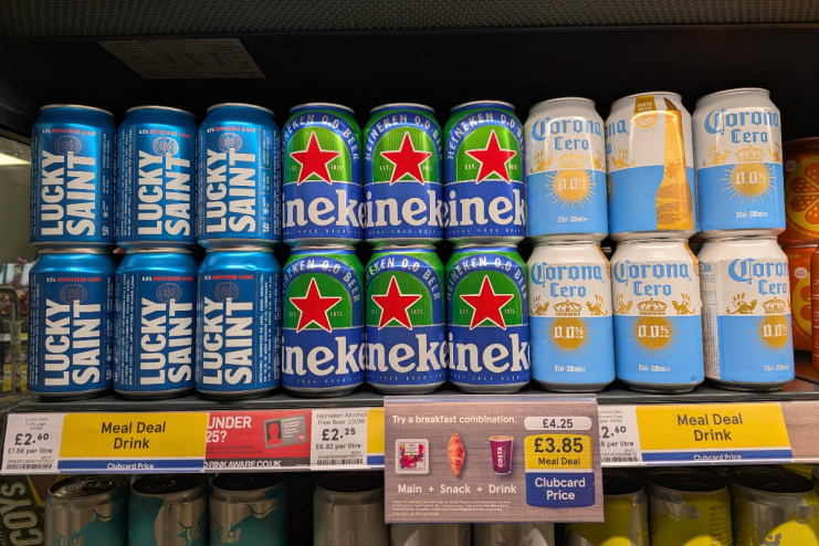 Tesco meal deal featuring Heineken and Corona beer bottles displayed on a store shelf