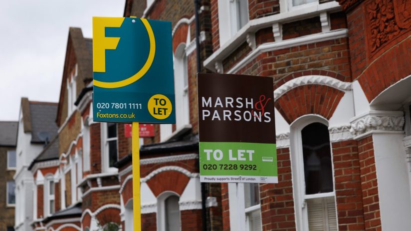UK cityscape with To Let signs on residential buildings, highlighting the competitive nature of the rental market in 2023.