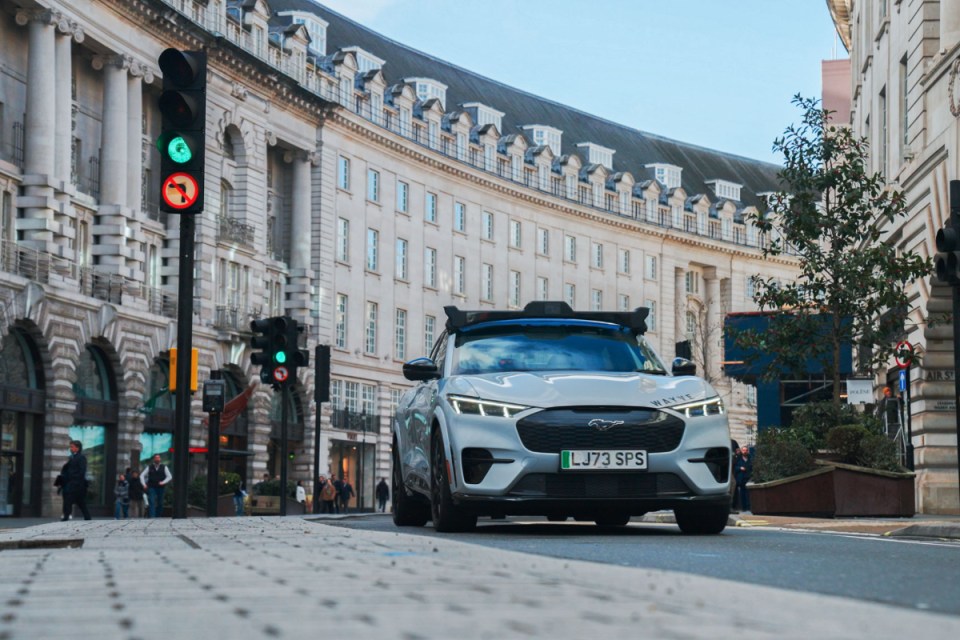 Wayve autonomous car navigating Regent Street, showcasing cutting-edge self-driving technology in an urban environment