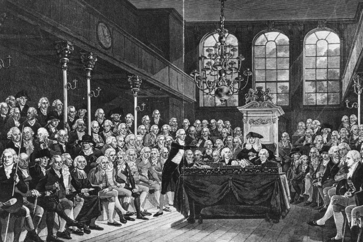 William Pitt the Younger delivering a speech in the historical parliament setting, showcasing 18th-century British politic...