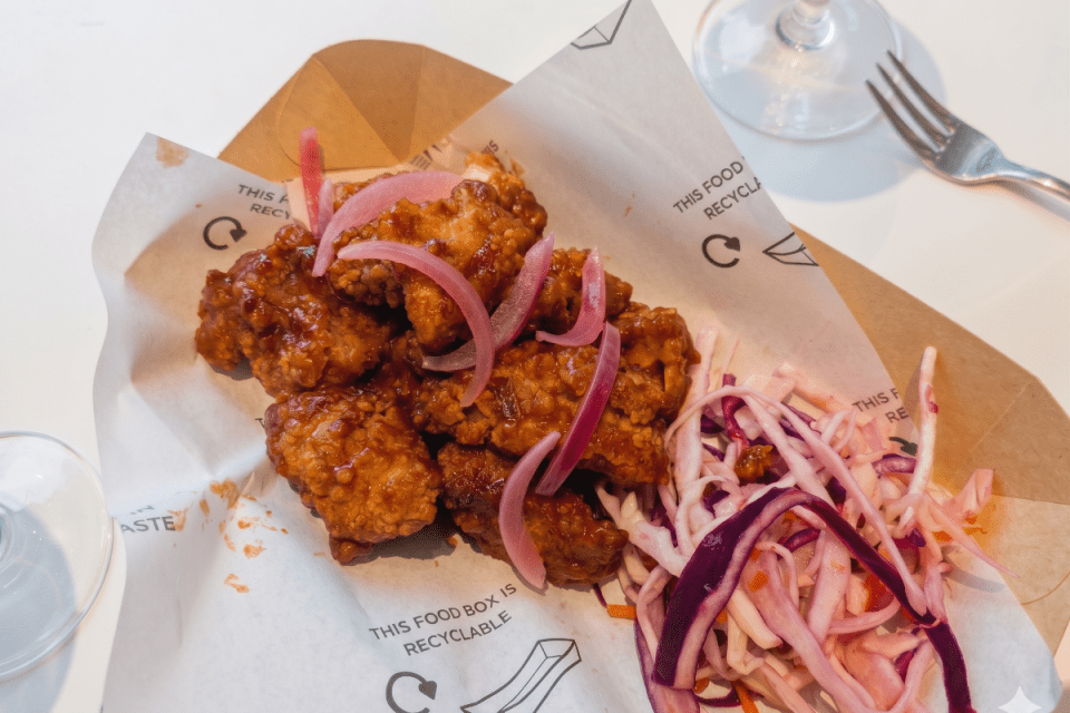 Wimbledon-themed strawberry fried chicken dish elegantly presented on a plate, showcasing a unique culinary fusion.