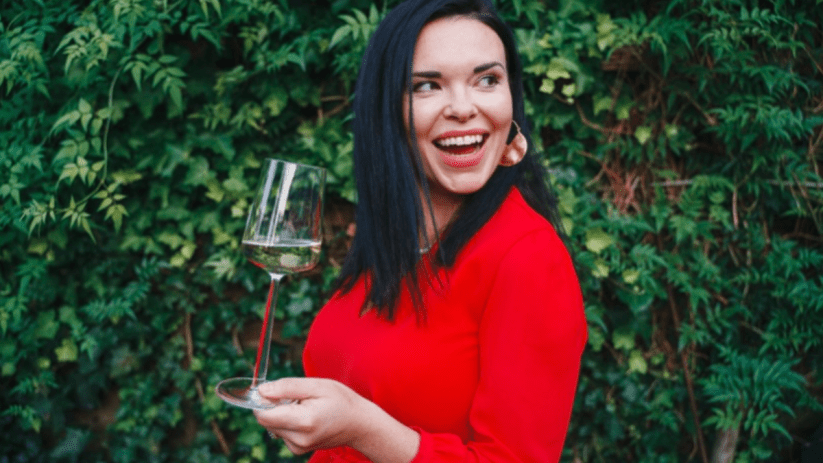 Wine and music enthusiasts enjoying a vibrant London event, featuring wine tasting and live performances in a lively setting.