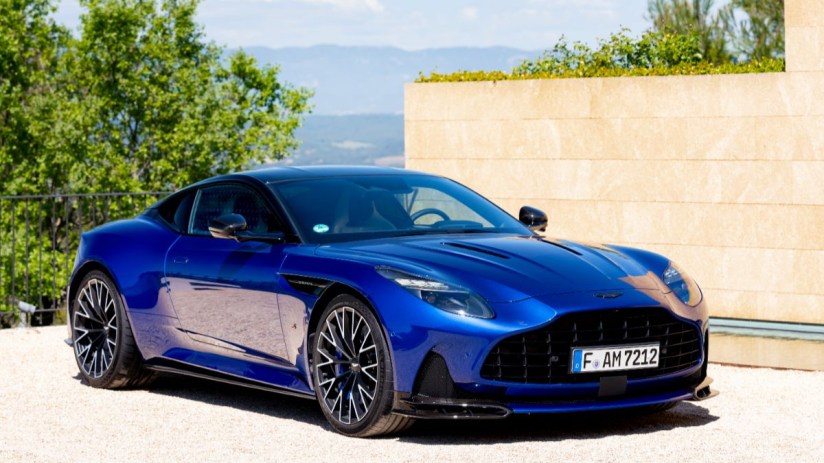 Aston Martin BD12 luxury sports car showcasing sleek design and high-performance features on a scenic road