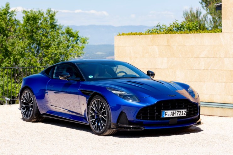 Aston Martin BD12 luxury sports car showcasing sleek design and high-performance features on a scenic road