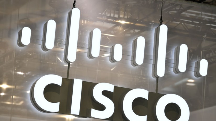 Cisco logo prominently displayed on a modern office wall, reflecting the companys innovative tech presence