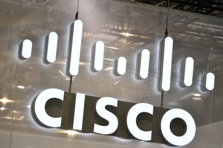 Cisco logo prominently displayed on a modern office wall, reflecting the companys innovative tech presence