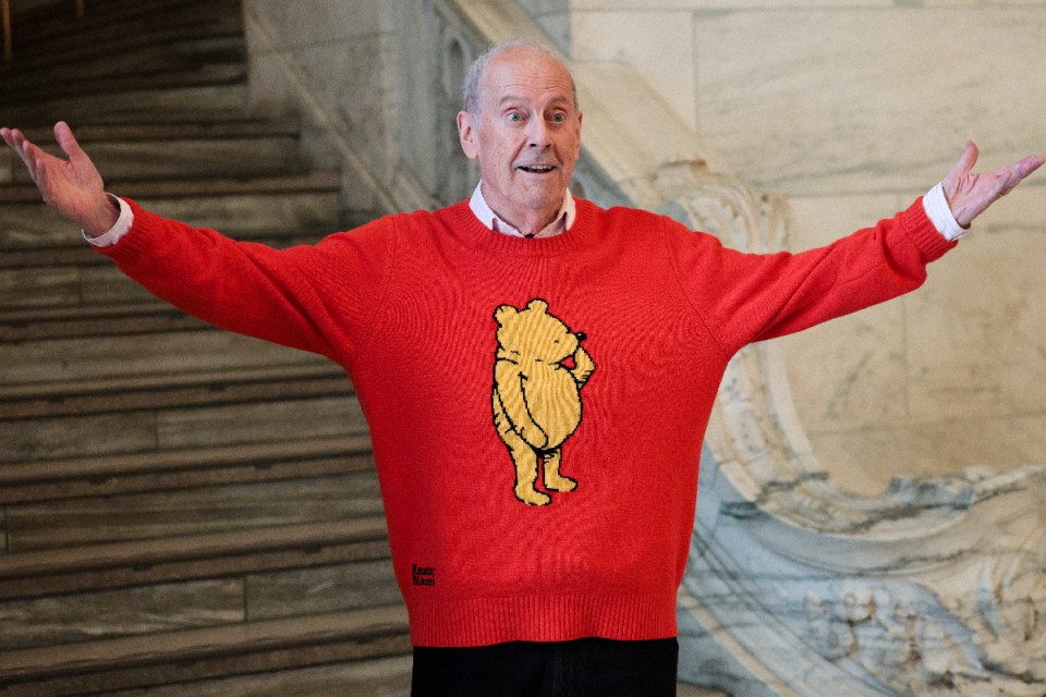Gyles Brandreth speaking at the Festival of Words, engaging audience with lively storytelling and insightful commentary