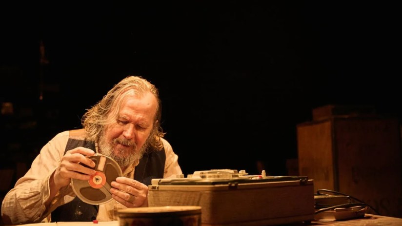 Gary Oldman as Krapp in a theatrical performance of Samuel Becketts Krapps Last Tape, portraying a contemplative scene.