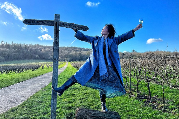 Libby Brodie enjoying a glass of English wine, highlighting the elegance and quality of local vintages in a business setting