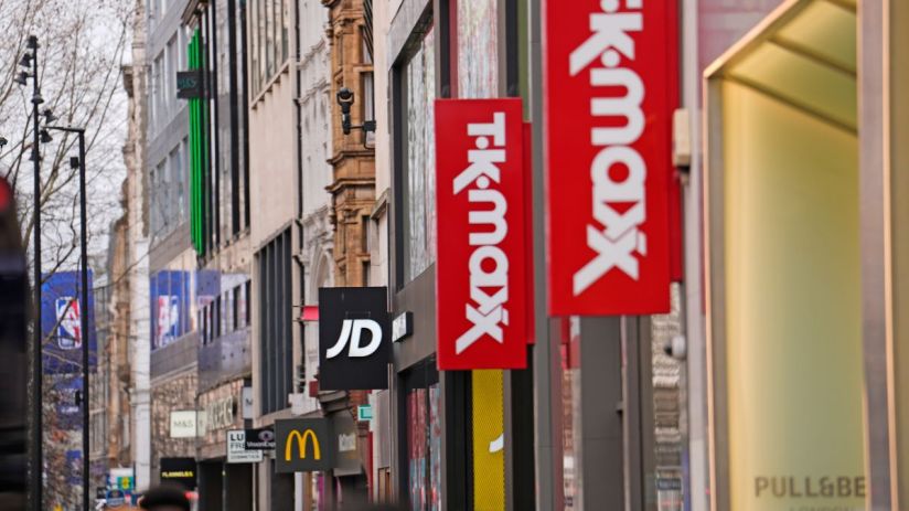 Busy retail store with diverse shoppers browsing aisles, highlighting vibrant displays and bustling atmosphere