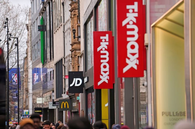 Busy retail store with diverse shoppers browsing aisles, highlighting vibrant displays and bustling atmosphere