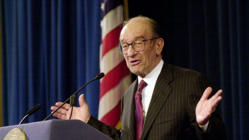 Alan Greenspan speaking at a financial conference, emphasizing economic trends and monetary policy insights in a formal se...
