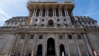 Bank of England headquarters with financial charts overlay, illustrating private credit stress test analysis