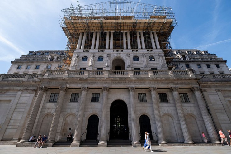 Bank of England headquarters with financial charts overlay, illustrating private credit stress test analysis