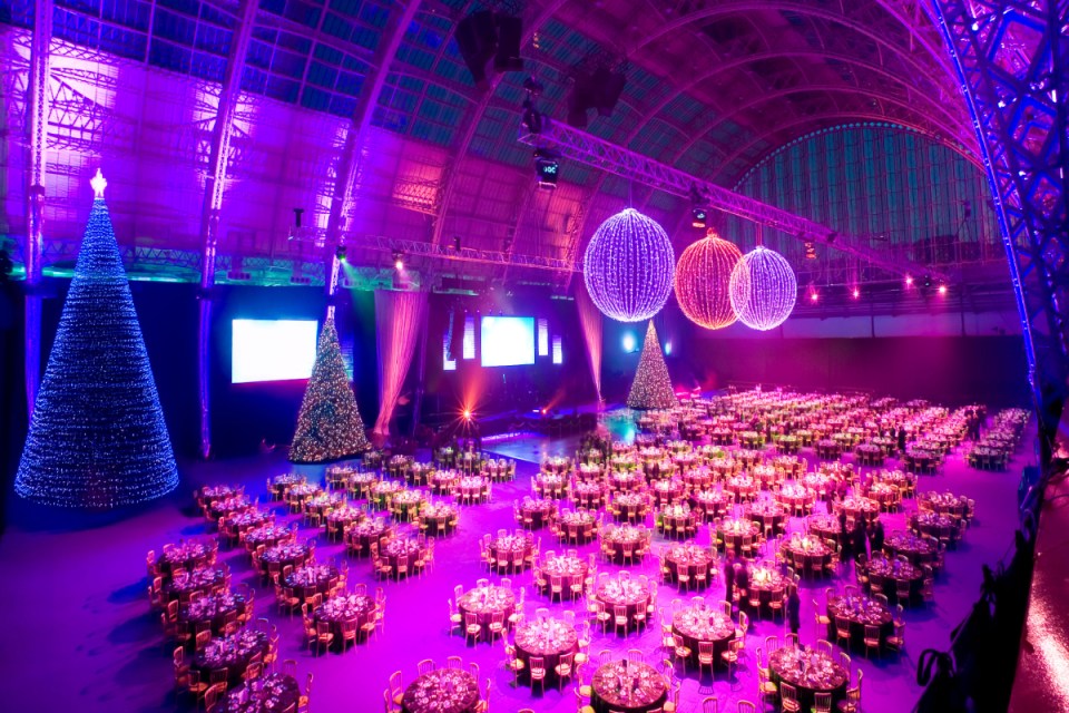 Elegant banquet hall setup with lavish table arrangements, sophisticated decor, and ambient lighting for a formal event.