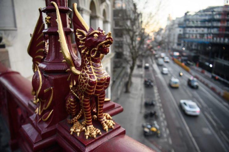 Canada boundary dragon statue symbolizing economic uncertainty amidst political instability