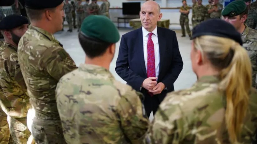 News article image depicting a significant business meeting with diverse executives discussing strategy around a conferenc...