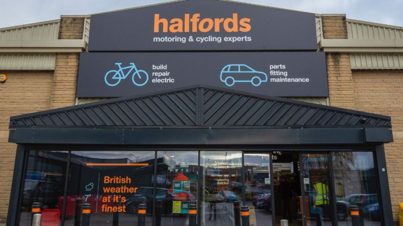 Halfords store exterior showcasing signage and entrance, highlighting the brands presence in the retail automotive sector.