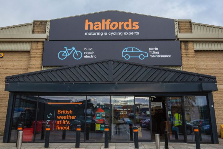 Halfords store exterior showcasing signage and entrance, highlighting the brands presence in the retail automotive sector.