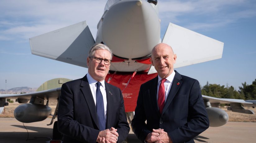 Healey and Starmer engage in discussion at a public event, focusing on key policy issues and future strategies.