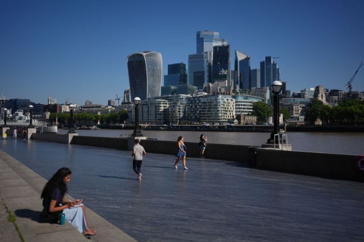 Scorching cityscape under intense heatwave with people seeking shade and hydration in bustling urban environment