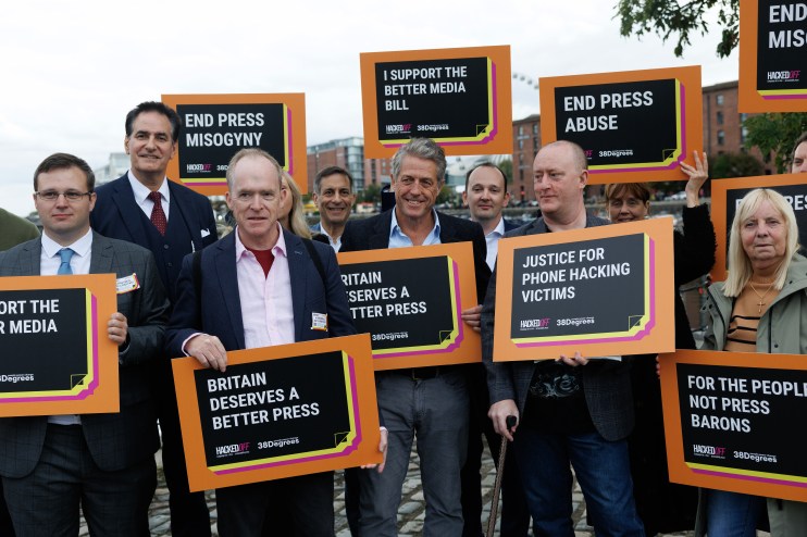 Hugh Grant expressing frustration, advocating for press regulation, amidst concerns over free speech and Downing Street po...