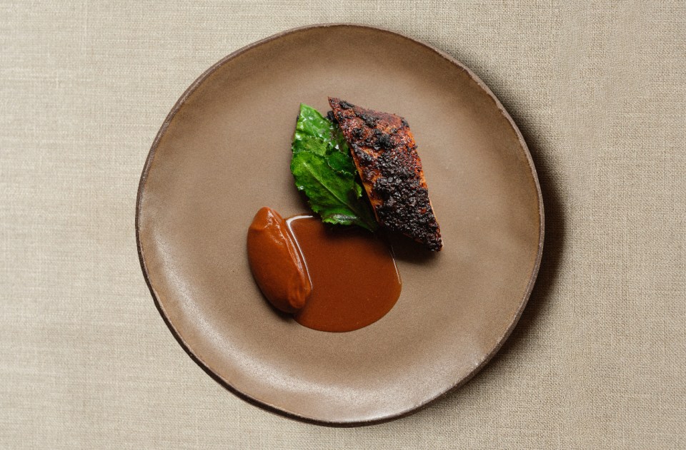 Duck mole dish by Anton Rodriguez, showcasing vibrant colors and intricate presentation, featured in KOL restaurant news.