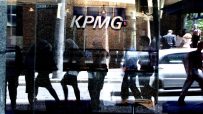 KPMG Australia office building exterior with modern glass architecture and corporate signage in a bustling business district.