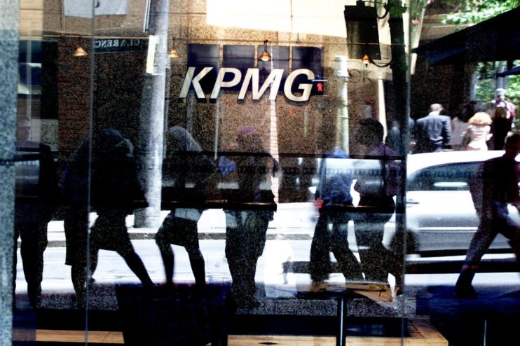 KPMG Australia office building exterior with modern glass architecture and corporate signage in a bustling business district.