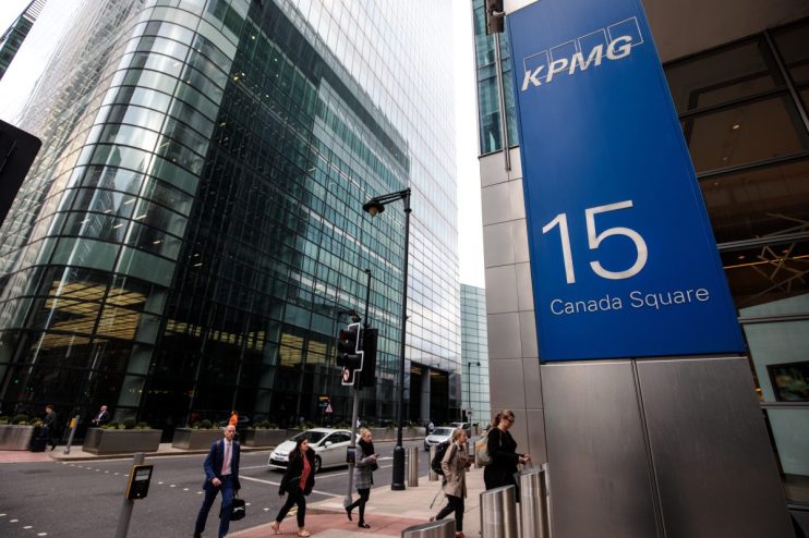 KPMG office building at Canary Wharf showcasing modern architecture and corporate environment.