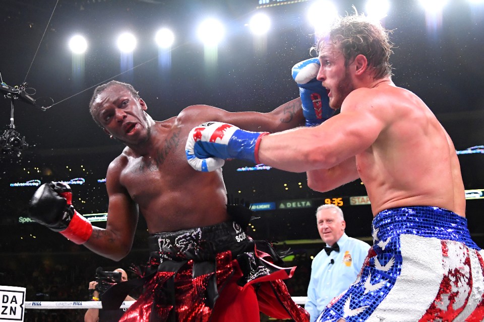 KSI and Logan Paul face off in a highly anticipated boxing match, showcasing intense rivalry and competitive spirit.