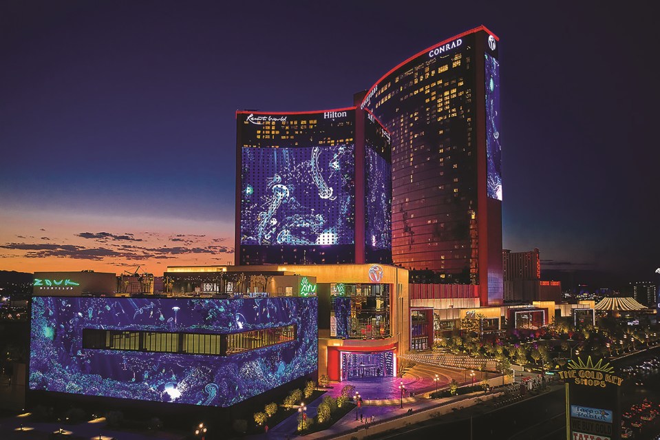 AI-powered robotic massage at Caesars Palace, Las Vegas, featuring two large robot arms in a modern spa setting
