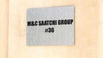 MC Saatchi advertising group office building exterior with company logo prominently displayed in a bustling urban setting