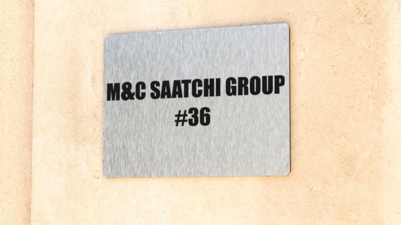 MC Saatchi advertising group office building exterior with company logo prominently displayed in a bustling urban setting