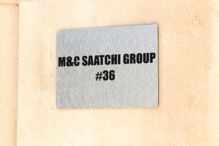 MC Saatchi advertising group office building exterior with company logo prominently displayed in a bustling urban setting