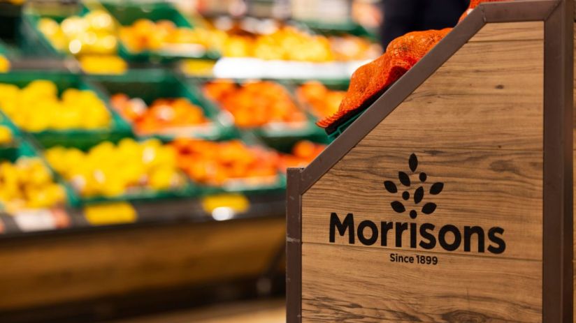 Morrisons supermarket exterior with branded signage, showcasing entrance and storefront, highlighting retail location.