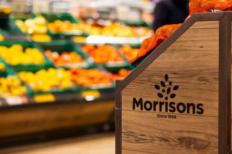 Morrisons supermarket exterior with branded signage, showcasing entrance and storefront, highlighting retail location.