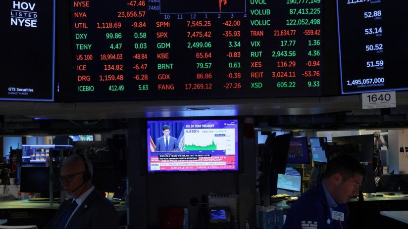 NYSE trading floor bustling with activity as traders monitor market trends and stock performance on electronic displays