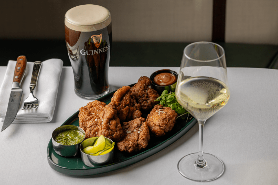 New Irish pub Horsemen Fitzgeralds opens in London, showcasing traditional decor with patrons enjoying drinks and lively a...