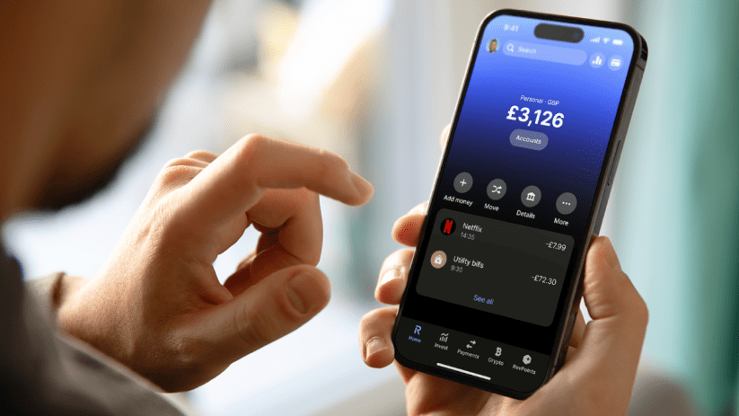 Revolut app interface showcasing new features and design on a smartphone screen in a UK business environment.