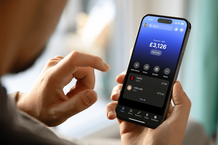 Revolut app interface showcasing new features and design on a smartphone screen in a UK business environment.