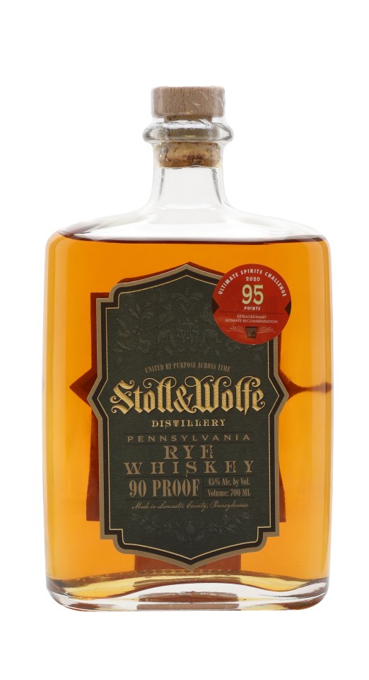 Stoll Wolfe Rye 3 Year Old whiskey bottle with label detail in a business setting, highlighting premium quality and crafts...