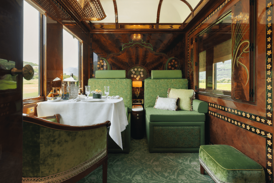 Scenic view from a luxury train journey through lush landscapes, showcasing one of the worlds top train travel experiences.