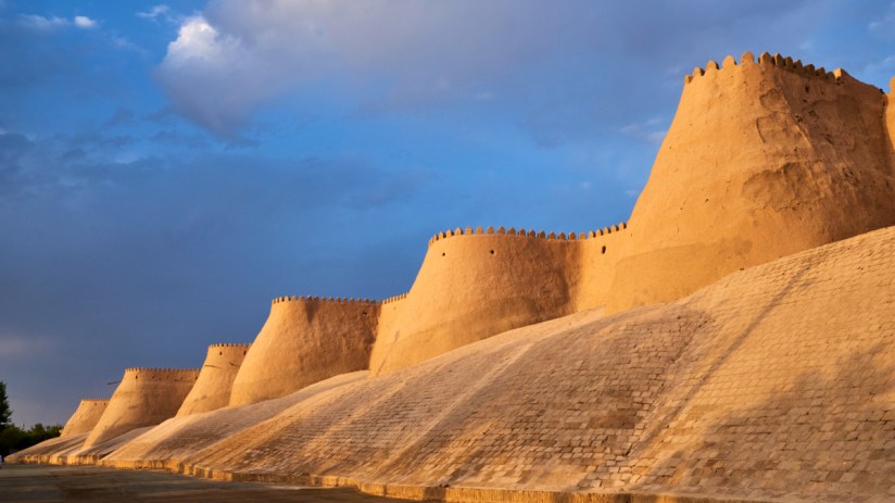 Historic architecture and vibrant streets of Khiva, Uzbekistan, showcasing ancient city walls and traditional Silk Road he...