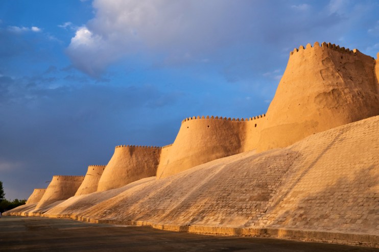 Historic architecture and vibrant streets of Khiva, Uzbekistan, showcasing ancient city walls and traditional Silk Road he...